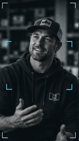 A smiling homeowner in a cap talking to camera in a locked-off interview frame.
